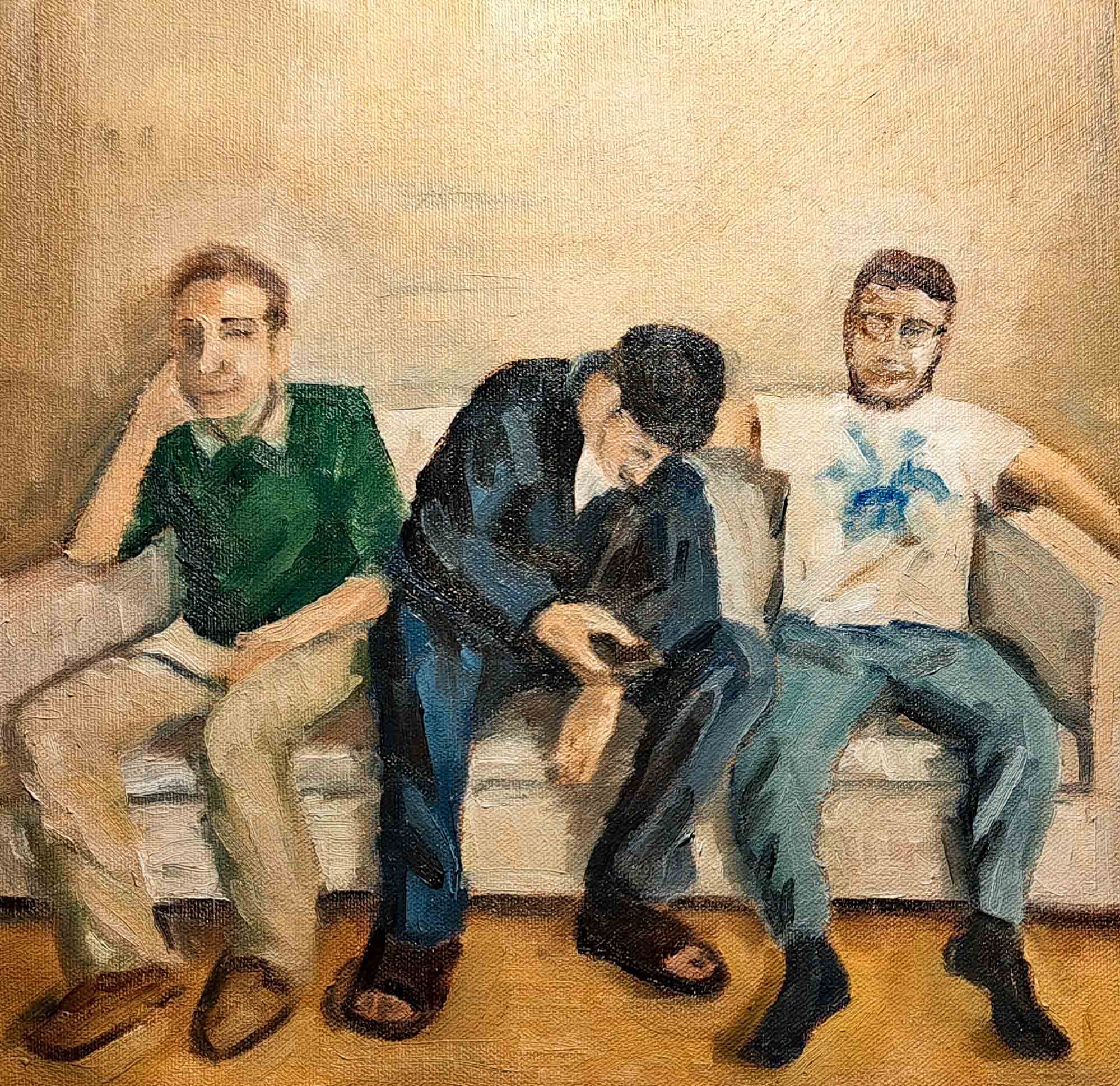 three people on a white sofa